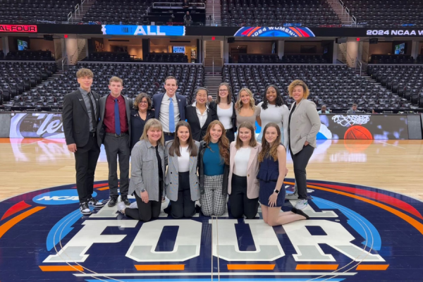 Group photo of Nicole Kraft, Aaron Klein and SSI students at the NCAA Women's Final Four.